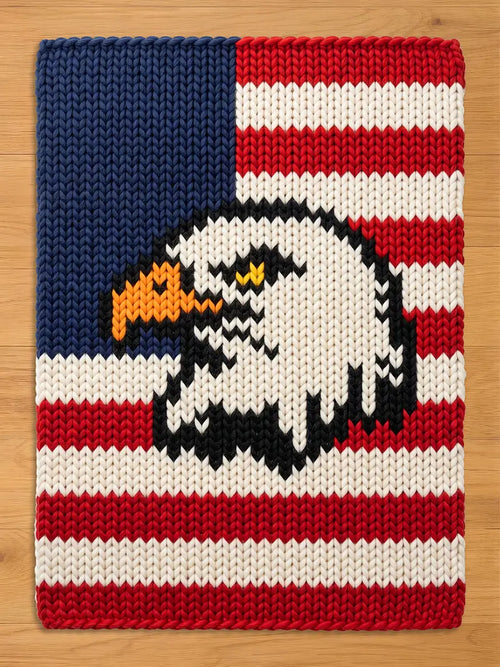 Thick-knit throw blanket featuring a bald eagle head design over an American flag pattern with red, white, and blue chunky yarn.