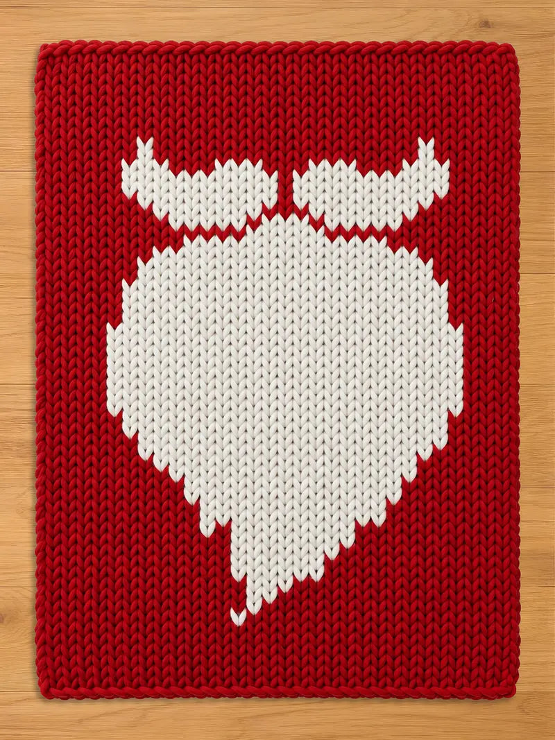 Chunky knit red blanket featuring a large white Santa beard and mustache silhouette